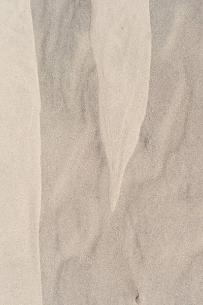 Uma Superfície Arenosa Com Algumas Curvas Linhas Moldando Padrões Perfeito — Fotografia de Stock