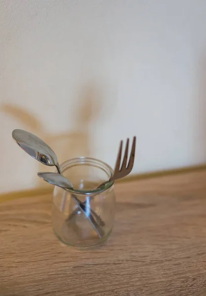 Vertical Shot Metal Spoons Fork Glass Jar Wooden Surface — Stock Photo, Image