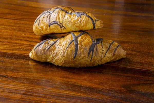 Close Shot Chocolate Drizzled Croissants Wooden Table — Stock Photo, Image