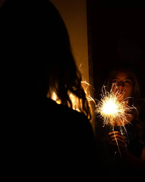 Latina Woman Holding Sparklers Front Mirror Dark Room — Stock Photo, Image