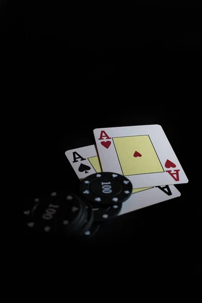 Vertical Shot Two Ace Cards Poker Chips Lights Black Background — 图库照片