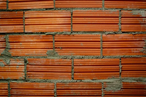 Uma Parede Tijolo Vermelho Cimentado Com Linhas Padrões — Fotografia de Stock