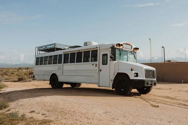 Horizontal Shot White Bus Side Dry Field Daylight — Stock Photo, Image