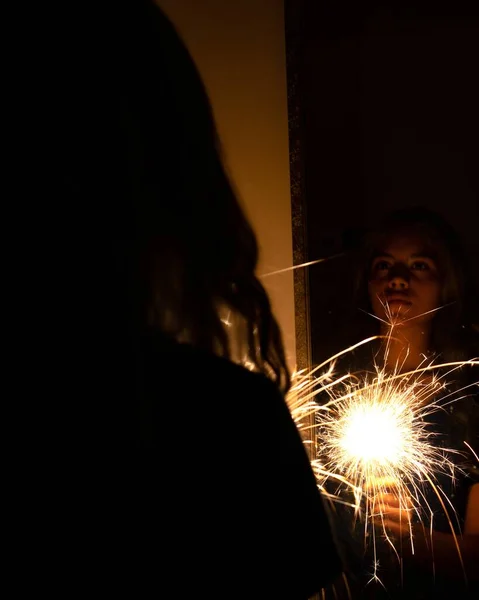 Latina Woman Holding Sparklers Front Mirror Dark Room — Stock Photo, Image