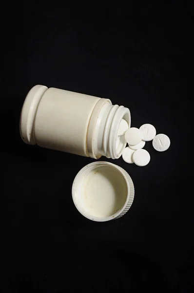 Vertical Shot White Pills Spilled Pills Bottle Black Background — Stock Photo, Image