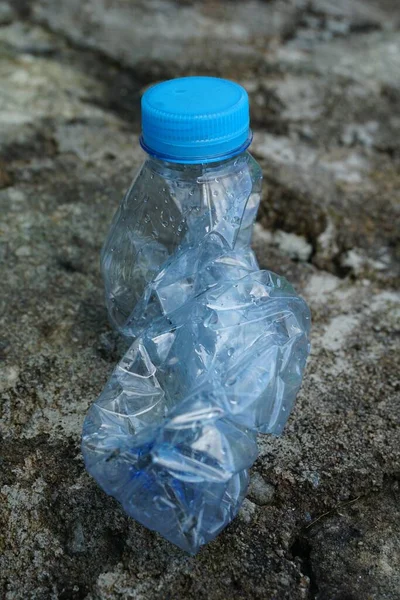 High Angle Shot Crushed Empty Water Bottle Stone Surface Captured — Stock Photo, Image