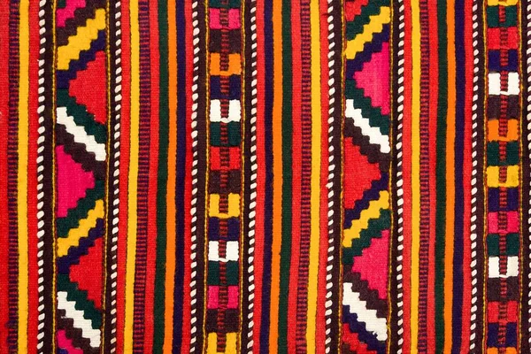 Close Uma Textura Têxtil Com Padrões Coloridos — Fotografia de Stock