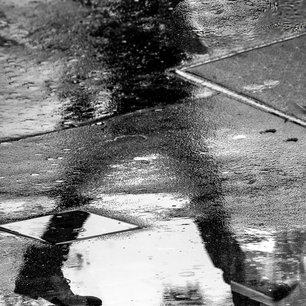 Close Grey Scale Shot Human Silhouette Reflected Wet Floor — Stock Photo, Image