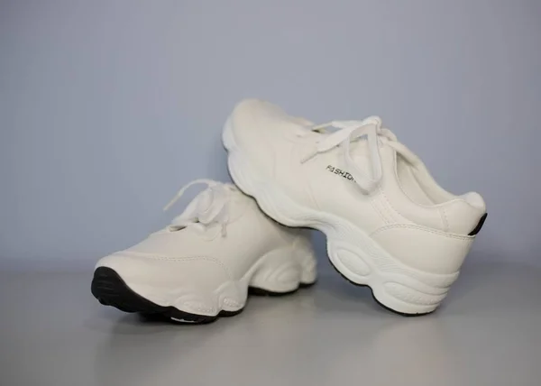 Closeup Shot Fashionable White Sneakers Gray Background — Stock Photo, Image