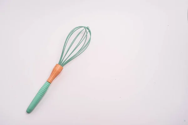 Closeup Shot Green Whisk Isolated Light Colored Background — Stock Photo, Image