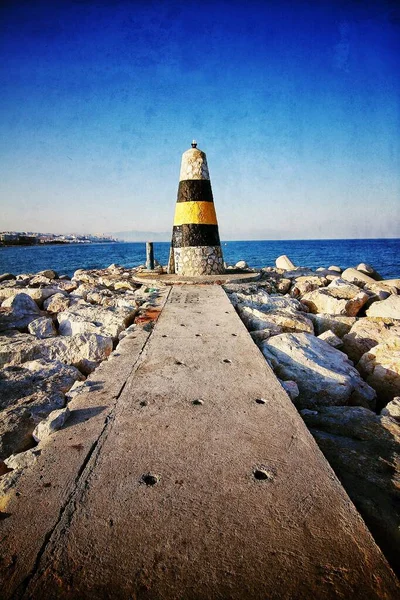 Vertical Shot Old Lighthouse End Pier Beautiful Calm Ocean — Stock Photo, Image