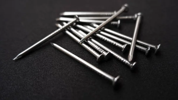 Closeup Shot Some Steel Nails Black Surface — Stock Photo, Image