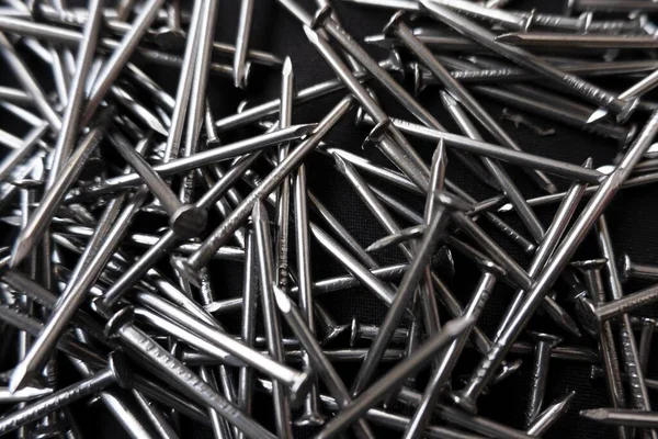 Closeup Shot Pile Steel Nails Black Surface — Stock Photo, Image