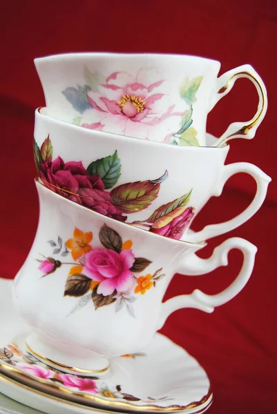 Stack White Coffee Cups Floral Paintings Red Background — Stock Photo, Image