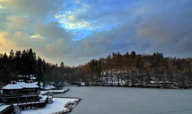 The Sovata resort near the Bear Lake in Romania in winter clipart