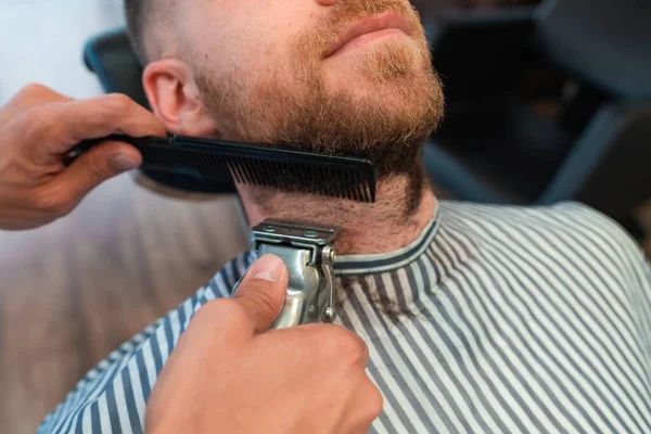 Closeup Young Hairdresser Shaving Male Customer Beard Comb Hair Clipper — Stock Photo, Image