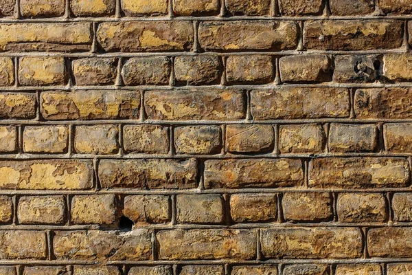 Eine Wand Aus Braunen Rechteckigen Steinen — Stockfoto