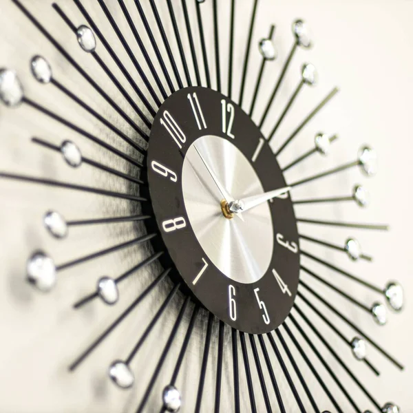 Closeup Shot Clock Decorated White Stones Black Sticks — Stock Photo, Image