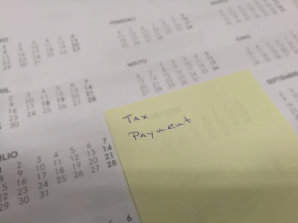 Closeup Shot Annual Calendar Note Tax Payment Yellow Sticker — Stock Photo, Image