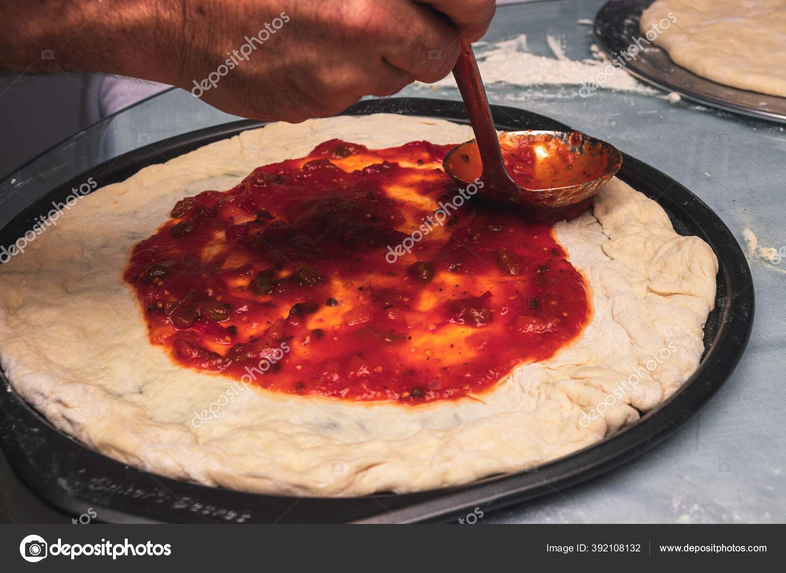 Chef Applying Tomato Sauce Ladle Pizza Dough Stock Photo by ©Wirestock 392108132