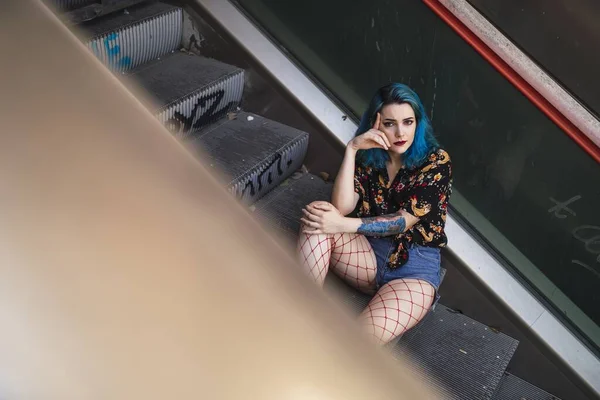 Young Female Blue Hair Wearing Shorts Sitting Escalator Sunlight — Stock Photo, Image