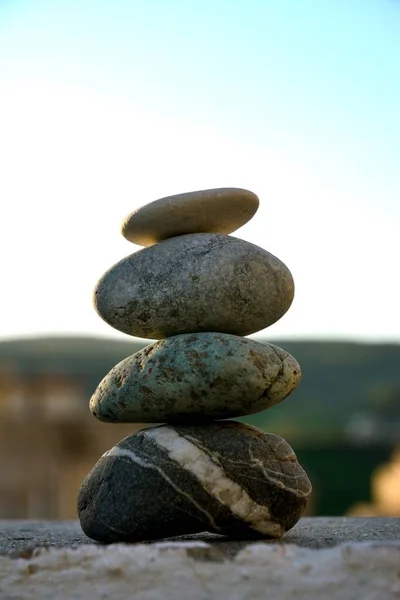 Vertical Shot Stacked Stones Rough Surface Blurry Background Concept Zen — Stock Photo, Image