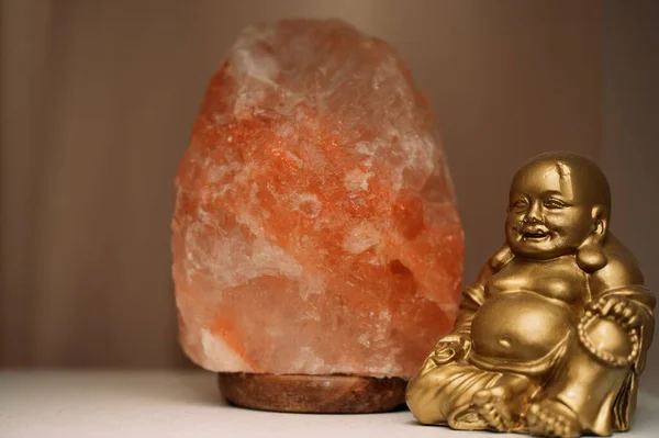 Closeup Shot Orange Mineral Stone Golden Buddhist Statue — Stock Photo, Image