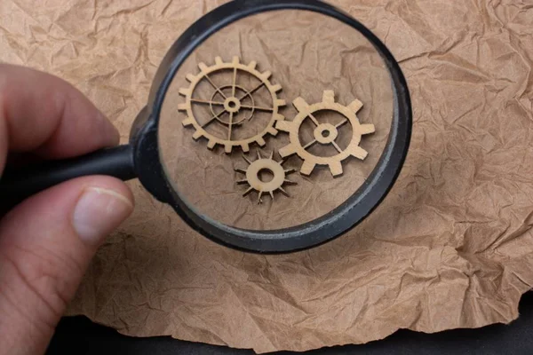 Closeup Person Looking Small Mechanism Gears Parchment Paper Magnifier — Stock Photo, Image