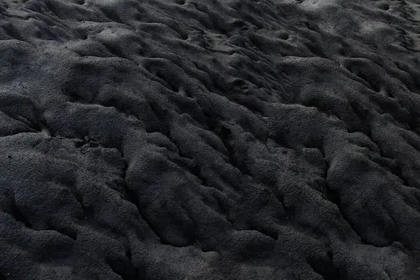 Een Grijswaarden Opname Van Het Zand Onder Lichten Koel Voor — Stockfoto