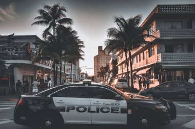 MIAMI, UNITED STATES - Sep 12, 2019: Miami South Beach Police car, parked on Ocean Drive, taking care of site security. clipart