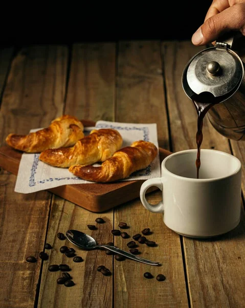 Vertical Shot Person Pouring Coffee White Mug Three Croissants Wooden — Stock Photo, Image