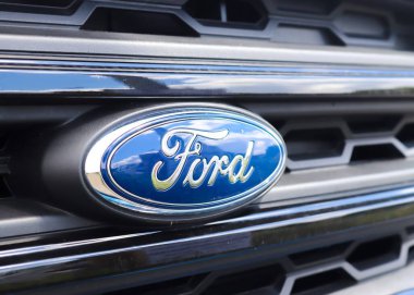 KIEL, GERMANY - Jul 15, 2020: Close up of the Ford logo on a new car front clipart