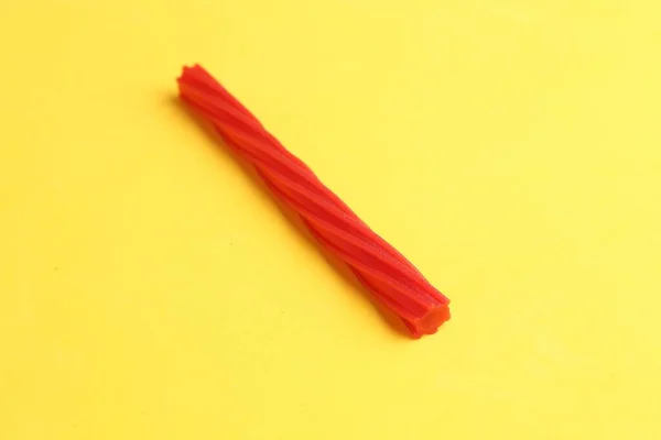Close Shot Red Sweet Licorice Isolated Yellow Background — Stock Photo, Image
