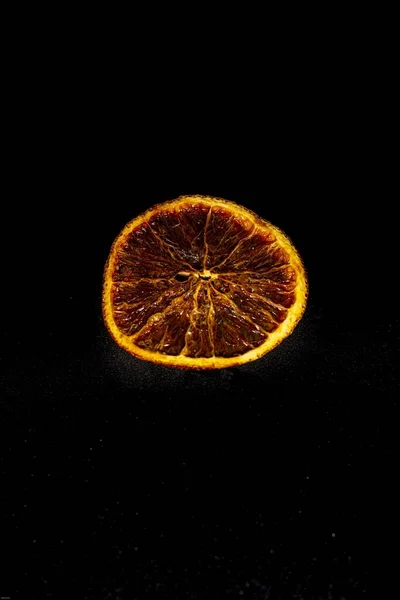 Closeup Shot Dried Orange Slice Isolated Black Background — Stock Photo, Image