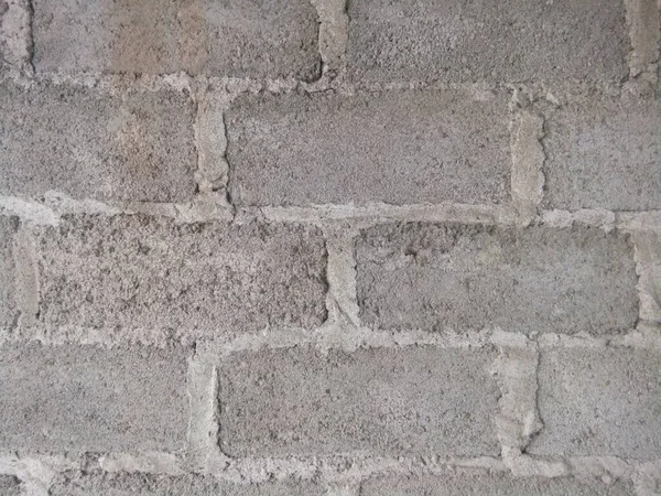 Eine Nahaufnahme Der Mauer Aus Grauen Rechteckigen Steinen Und Beton — Stockfoto