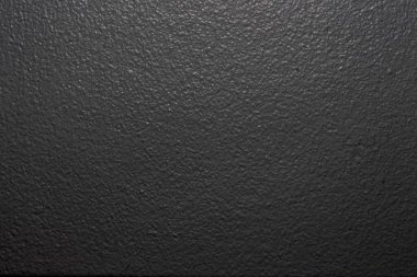 A closeup shot of a black rough wall surface clipart