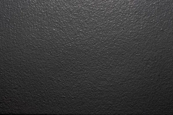 黒い粗い壁の表面のクローズアップショット — ストック写真