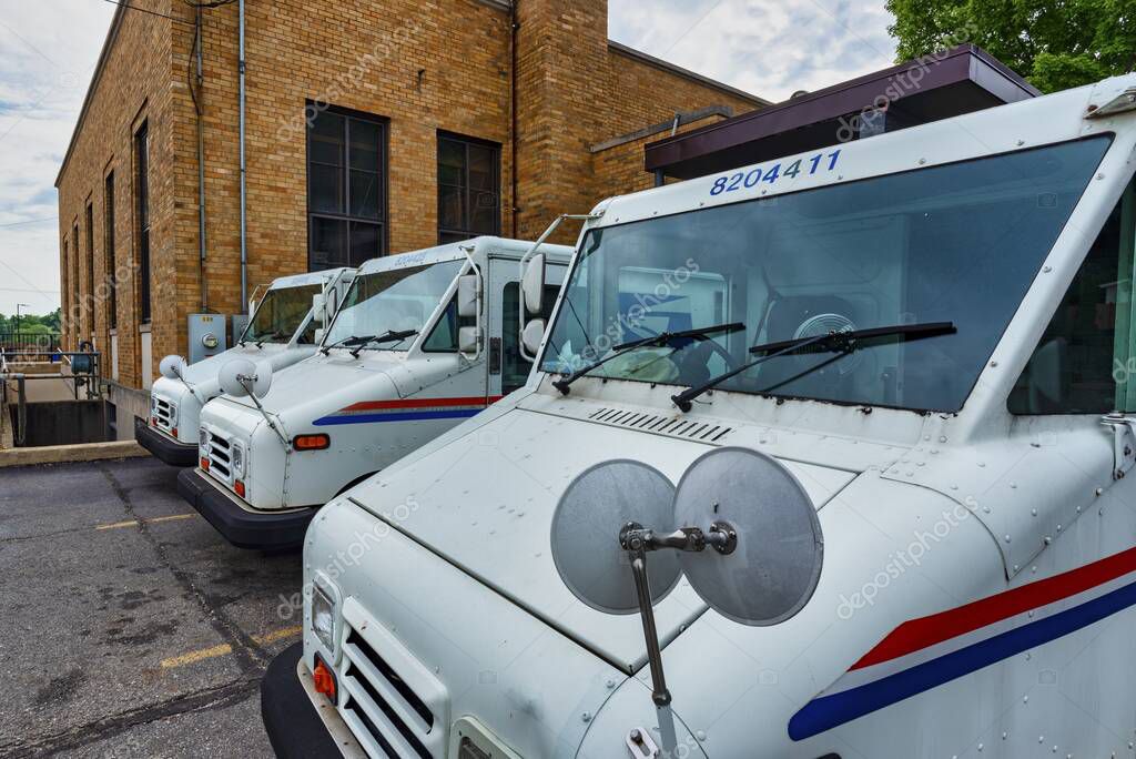 GRAND LEDGE, UNITED STATES - Jun 21, 2020: GRAND LEDGE, MI  June 21: View of United States Post Office delivery vehicle in Grand Ledge, MI on June 21, 2020