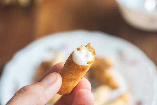 Soft Focus Person Holding Half Eaten Breaded Cheese Blurry Background — Stock Photo, Image