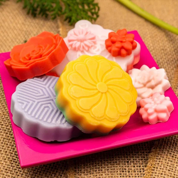 Some Colorful Soaps Patterns Shaped Flowers Pink Plate — Stock Photo, Image