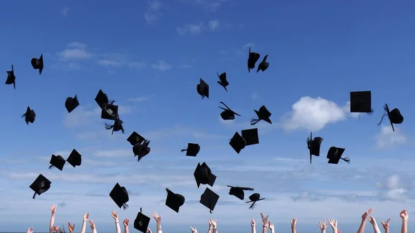 Graduates Celebrate Award Degrees Throw Caps Sunny Blue Sky — Stock Photo, Image