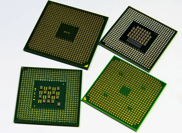 Een Close Shot Van Vier Laptop Processors Witte Achtergrond — Stockfoto