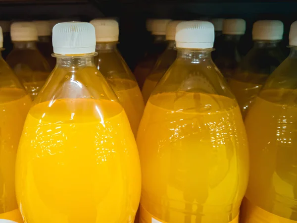 A closeup shot of orange juice bottles