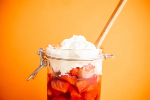 https://st4.depositphotos.com/27201292/39891/i/450/depositphotos_398911576-stock-photo-closeup-strawberry-jam-whipped-cream.jpg