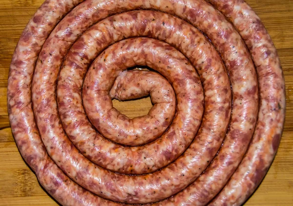 Overhead Shot Coiled Raw Sausage Wooden Board — Stock Photo, Image