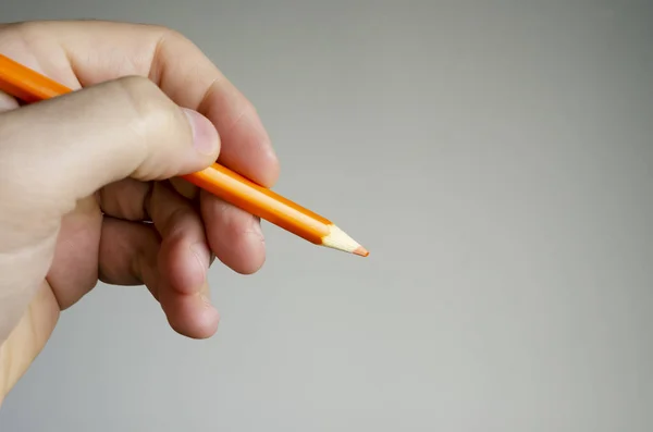 Nahaufnahme Eines Orangefarbenen Bleistifts Den Jemand Der Hand Hält — Stockfoto