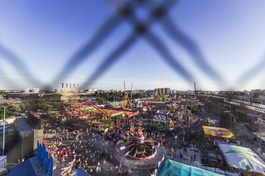 A high angle shot from a Ferris wheel looking down on a carnival in Jerez de la Frontera, Spain clipart