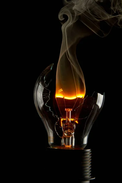 Vertical Shot Burning Light Bulb Smoke Coming Out Isolated Black — Stock Photo, Image