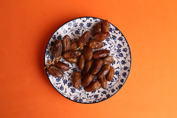 Top View Moroccan Dates Plate Isolated Orange Background — Stock Photo, Image