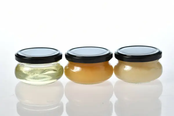 Closeup Shot Jars Honey White Background — Stock Photo, Image